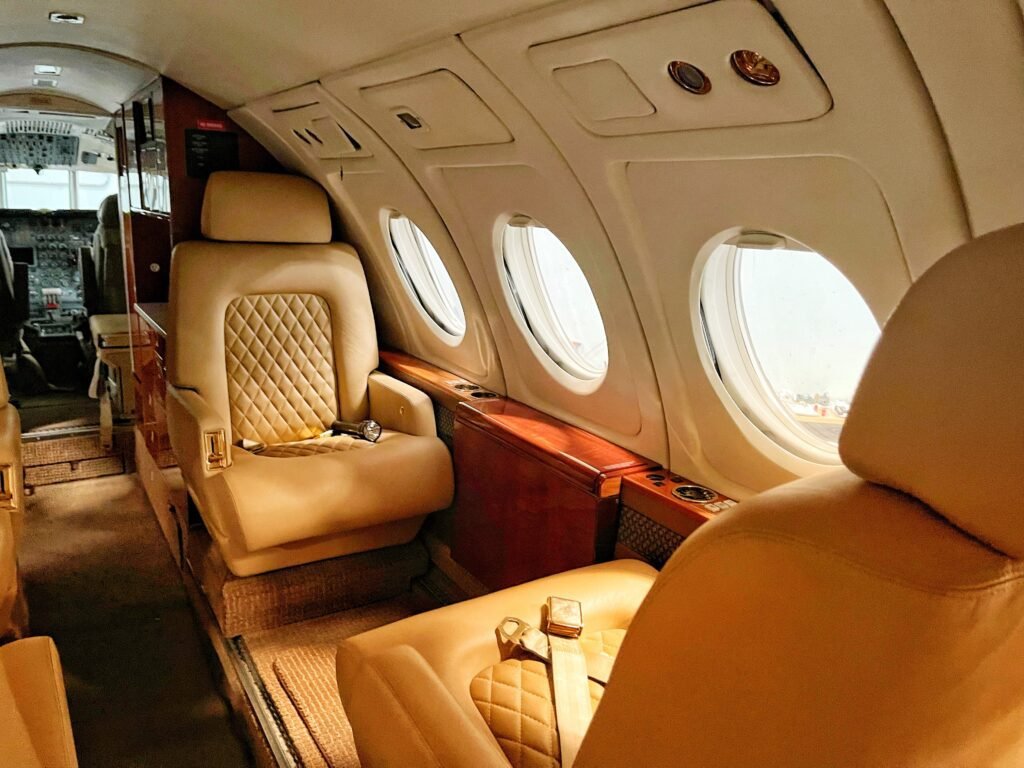 A small airplane with two seats and windows.